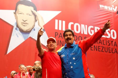 FILE PHOTO: Venezuela's President Nicolas Maduro (R) embraces retired General Hugo Carvajal as they attend the Socialist party congress in Caracas