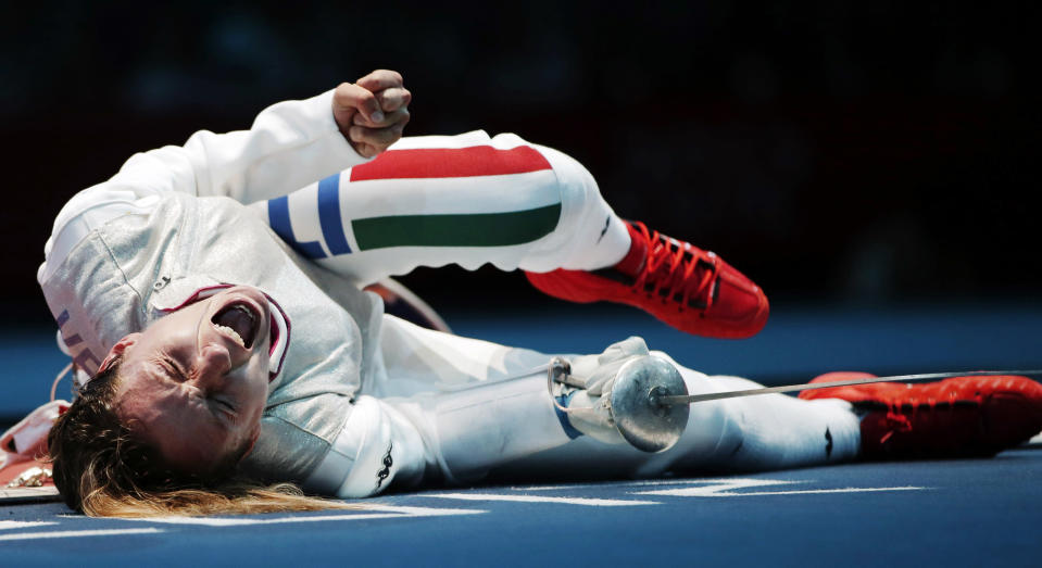 Valentina Vezzali of Italy reacts to winning her round of 16 match against Ines Boubakri of Tunisa during women's fencing at the 2012 Summer Olympics, Saturday, July 28, 2012, in London. (AP Photo/Andrew Medichini)
