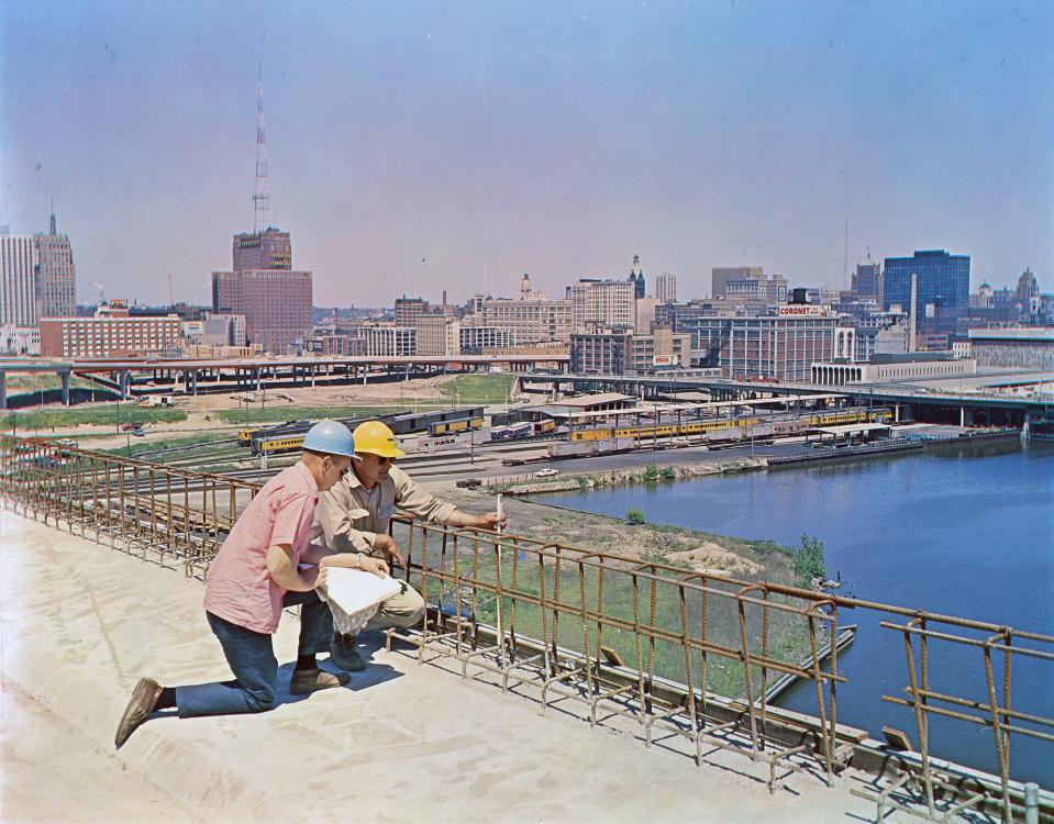 Two engineers on the North-South Freeway project check reinforcing rods on the bridge above the Menomonee River valley, running into the Marquette Interchange, during construction of the heart of the Milwaukee freeway system during the summer of 1968.