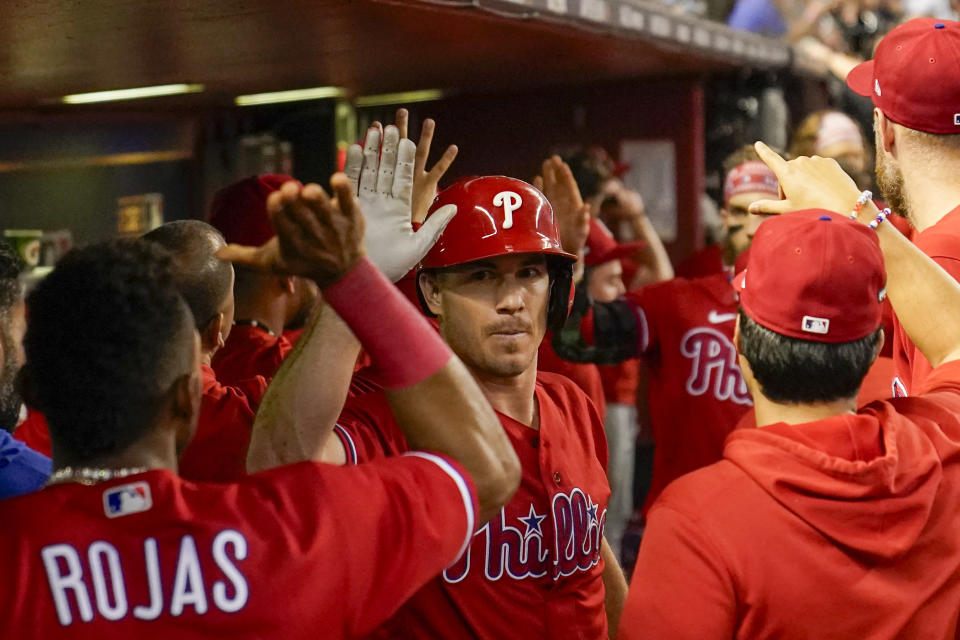 Philadelphia Phillies' J.T. Realmuto celebrates his two run home run against the Arizona Diamondbacks during the eighth inning in Game 5 of the baseball NL Championship Series in Phoenix, Saturday, Oct. 21, 2023. (AP Photo/Brynn Anderson)