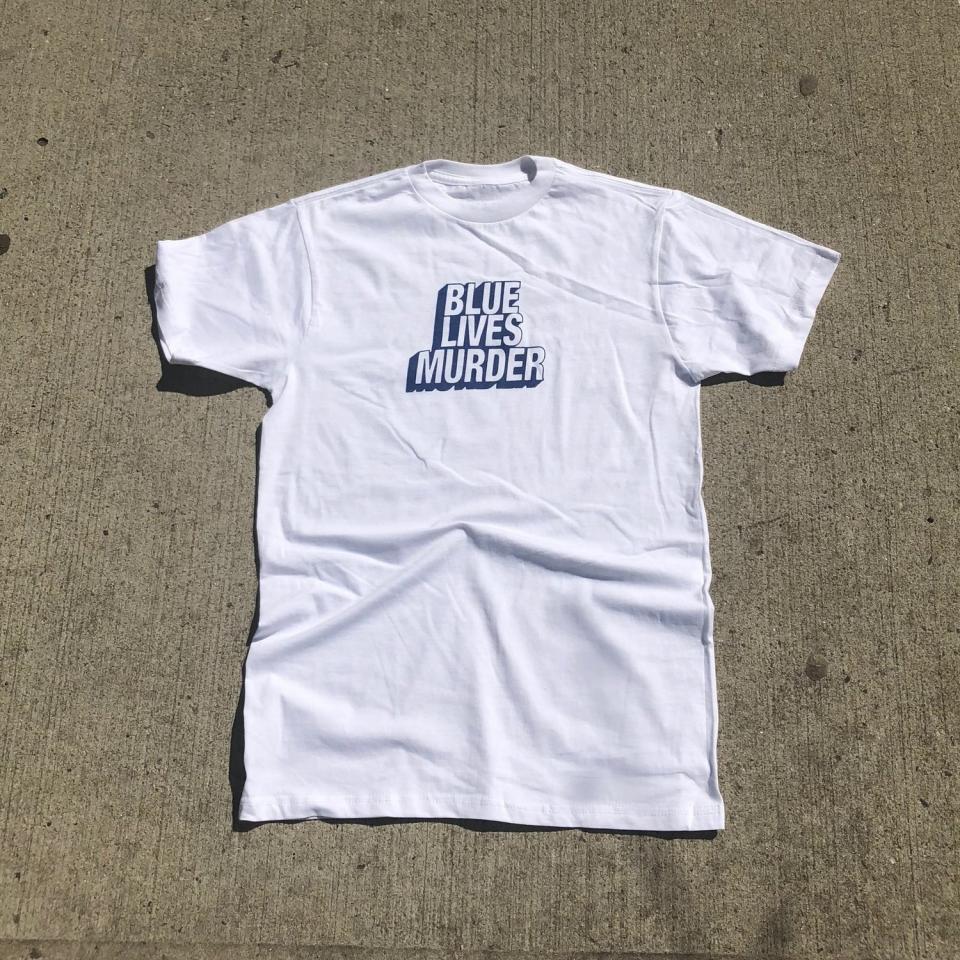 The “Blue Lives Murder” tee, $30, is available on americahates.us. The label, America Hates Us, will donate 20 percent of any purchase to one of four organizations listed on its site, including the ACLU and Planned Parenthood. (Photo: America Hates Us)