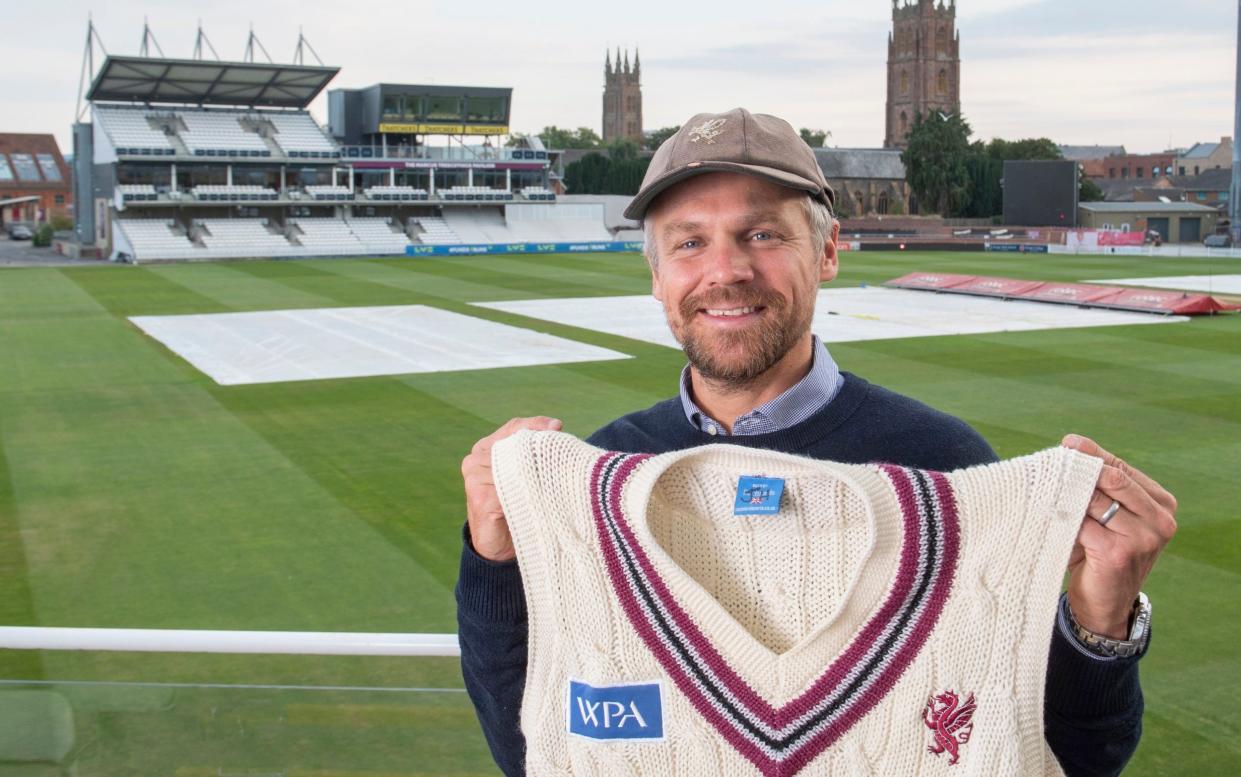 James Hildreth in front of the The churches of St James and St Mary Magdalene and the Marcus Trescothic stand at The County ground, home of Somerset County Cricket Club in Taunton - DALE CHERRY