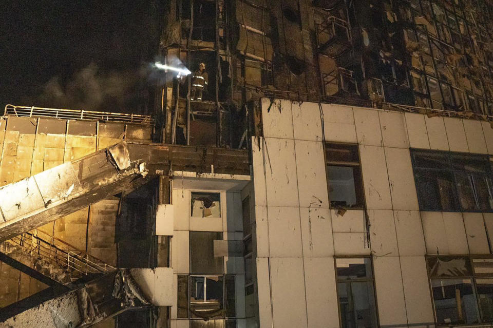 In this photo provided by the Odesa Region Administration, firefighters work to extinguish a fire in a hotel at the seaport after a Russian rocket attack in Odesa, Ukraine, Monday, Sept. 25, 2023. (Odesa Region Administration via AP)