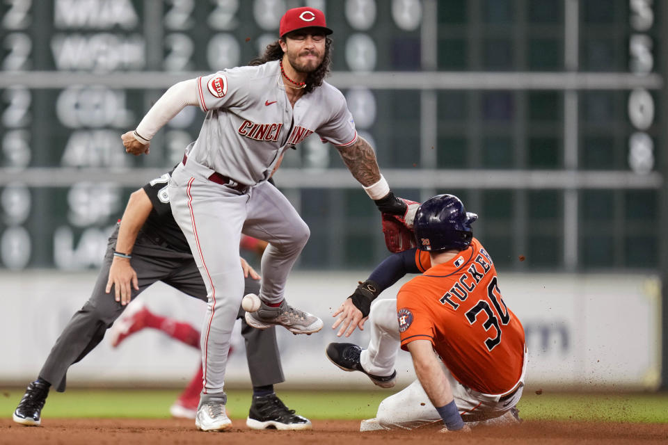 Houston Astros' Kyle Tucker, right, steals second as Cincinnati Reds second baseman Jonathan India attempts to make a tag during the fourth inning of a baseball game, Friday, June 16, 2023, in Houston. (AP Photo/Eric Christian Smith)