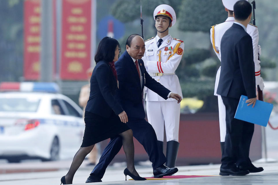 Vietnam's Prime Minister Nguyen Xuan Phuc, second left, arrives for the opening ceremony of the 13th National Congress of Vietnam's Communist Party (VCP), in Hanoi, Vietnam Tuesday, Jan. 26, 2021. (AP Photo/Minh Hoang)