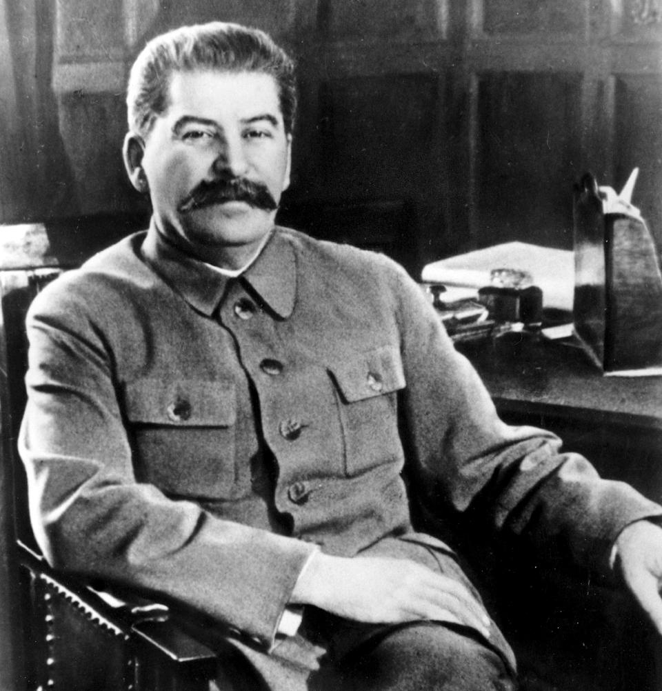 FILE - Josef Stalin, secretary-general of the Communist Party of the Soviet Union and premier of the Soviet state, poses at his desk in the Kremlin, Moscow, Russia in Feb. 1950. Stalin's death from a cerebral hemorrhage in 1953 was traumatic for Soviets who venerated him. (AP Photo/File)