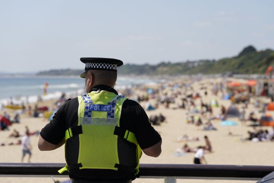 A police officer on patrol near Bournemouth beach (PA)