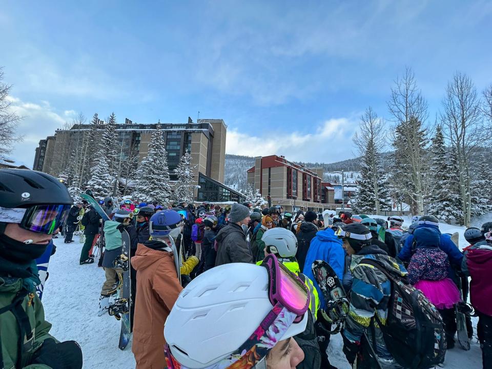 Crowds wait for shuttle buses at the Copper Mountain Ski Resort in Colorado.