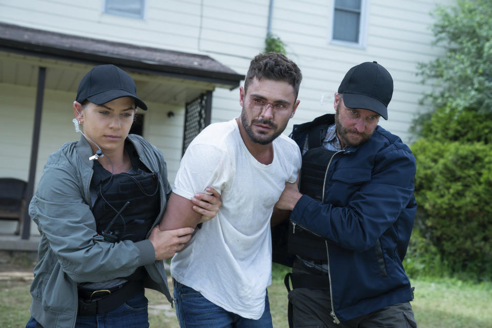 This image released by Universal Pictures shows Zac Efron, center, in a scene from "Firestarter." (Ken Woroner/Universal Pictures via AP)