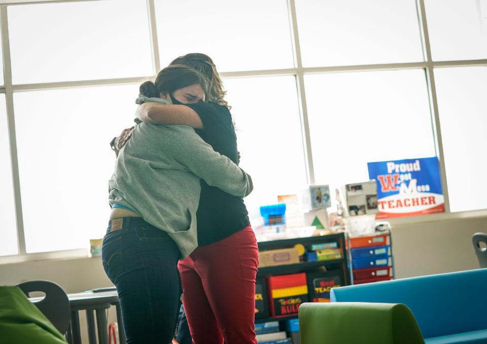 Stephanie Davy comforts a student during health class.