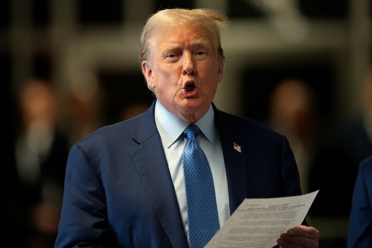 Donald Trump pictured speaking to reporters before walking into court on 9 May. On Thursday the presiding judge Juan Merchan denied the former president’s request to lift a gag order placed on him  (via REUTERS)