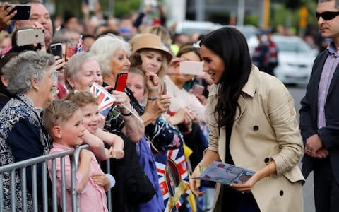 The Duchess of Sussex speaks to members of the public as she arrives at the Royal Botanic Gardens in Melbourne - Credit: Phil Noble/Getty