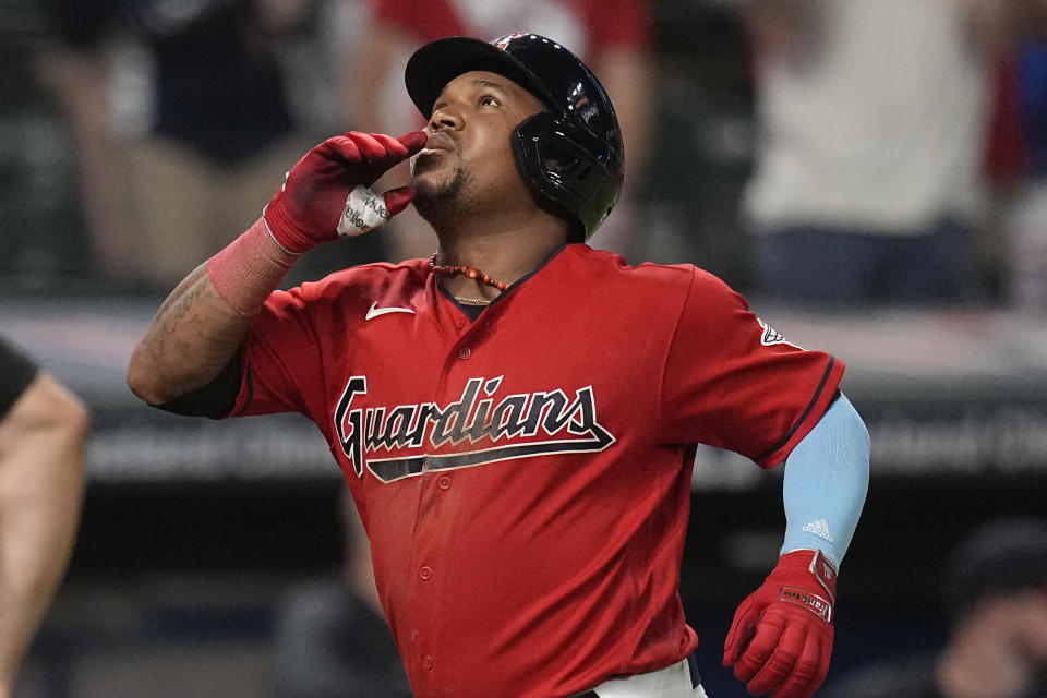 Cleveland Guardians' Jose Ramirez gestures as he nears the plate on a home run against the Kansas City Royals during the sixth inning of a baseball game Thursday, July 6, 2023, in Cleveland. (AP Photo/Sue Ogrocki)