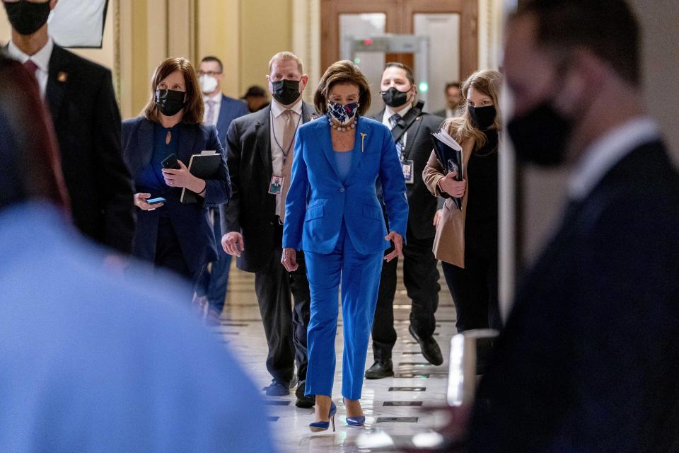House Speaker Nancy Pelosi of Calif., back to her office after convening the House for legislative business at the Capitol in Washington, Tuesday, Oct. 12, 2021. The House is expected to vote to increase the debt limit later this afternoon. (AP Photo/Andrew Harnik)
