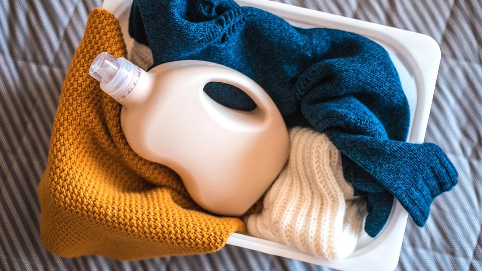 how to unshrink a sweater with basket of laundry