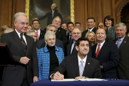 FILE PHOTO - U.S. House Speaker Paul Ryan (R-WI) signs a bill repealing Obamacare at the U.S. Capitol in Washington January 7, 2016. The U.S. Congress on Wednesday approved legislation dismantling President Barack Obama's signature health care plan, putting on his desk an election-year measure that faces a certain veto. REUTERS/Jonathan Ernst/File Photo