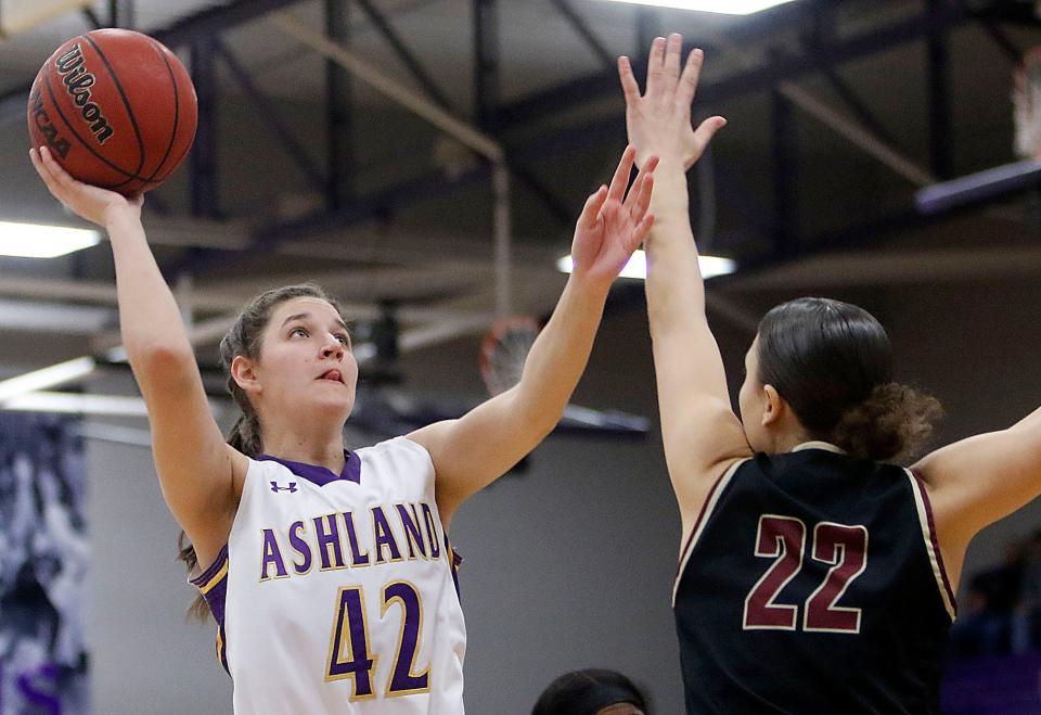 Ashland University's Annie Roshak (42) shoots as Walsh University's Mayci Sales (22) defends during first half college women's basketball action in the Great Midwest Athletic Conference tournament championship game on Saturday, March 5, 2022 at Kates Gymnasium. TOM E. PUSKAR/TIMES-GAZETTE.COM