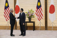Japan's Prime Minister Fumio Kishida, right, and Malaysian Prime Minister Ismail Sabri Yaakob, left, speak after exchanging memorandum at the Prime Minister's official residence Friday, May 27, 2022 in Tokyo. (AP Photo/Eugene Hoshiko, Pool)