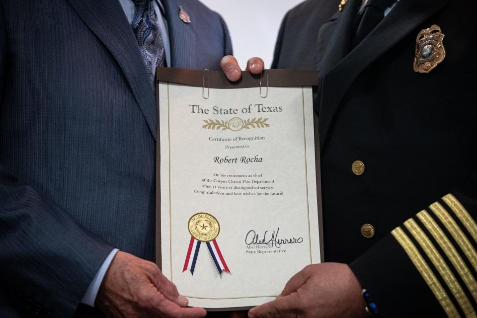 Corpus Christi Fire Chief Robert Rocha is recognized by state Sen. Juan "Chuy" Hinojosa during Rocha's retirement ceremony on Friday, Jan. 20, 2023, in Texas.