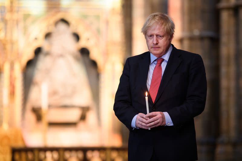 Britain's Prime Minister Boris Johnson visits the Grave of the Unknown Warrior, in Westminster Abbey, in London