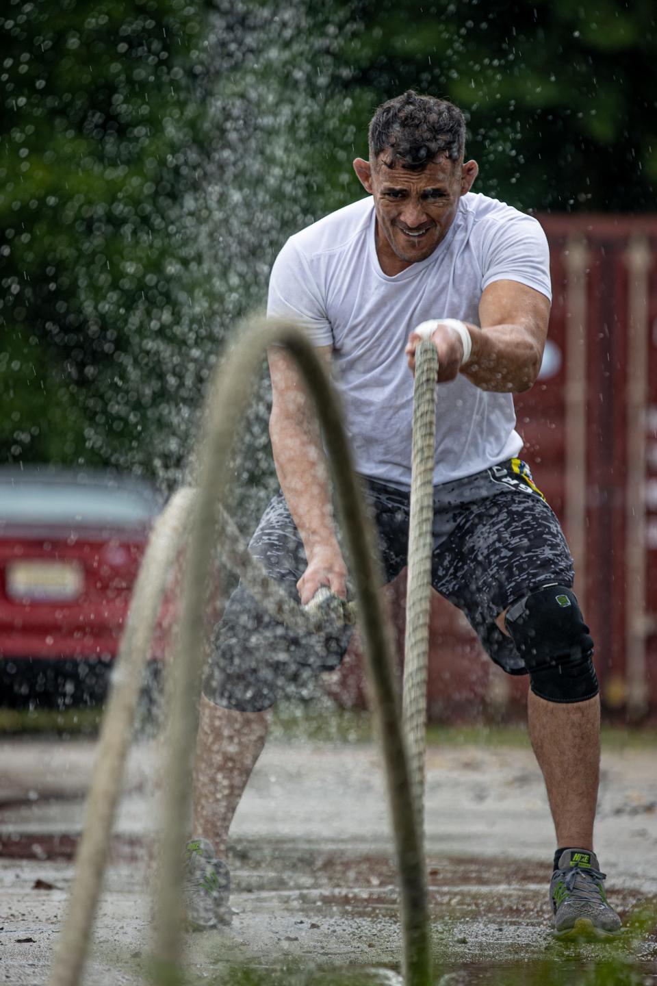 Alabama National Guard Pfc. Elioenai Campos whips a set of battle ropes during a strength and conditioning training session in Columbiana, Alabama, June 10, 2022. Campos is part of the United States national jiu-jitsu team set to compete for international honors at the World Games in Birmingham.