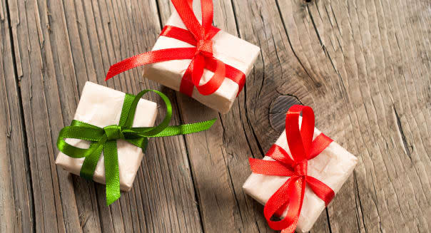 Gift boxes on old wooden background