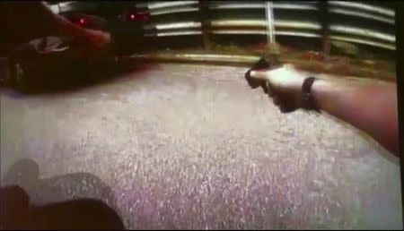 University of Cincinnati police officer Ray Tensing's body camera shows his handgun drawn after driver Samuel Dubose was pulled over and shot during a traffic stop in Cincinnati, Ohio July 19, 2015, in a still image from video released by the Hamilton County Prosecutor's Office on July 29, 2015. REUTERS/Hamilton County Prosecutor's Office/Handout via Reuters