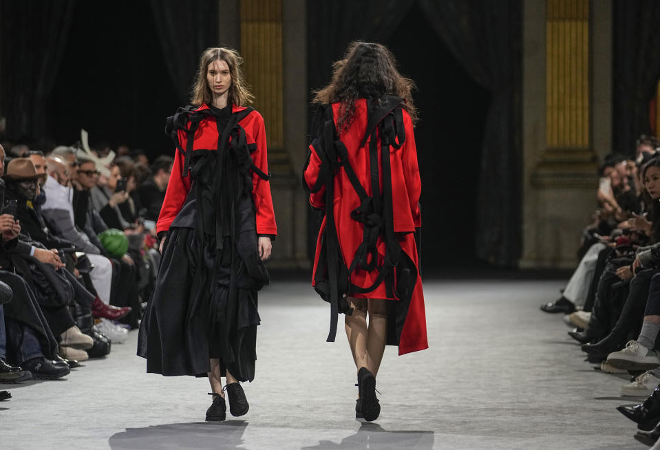 Models wear creations as part of the Yohji Yamamoto Fall/Winter 2023-2024 ready-to-wear collection presented Friday, March 3, 2023 in Paris. (AP Photo/Michel Euler)