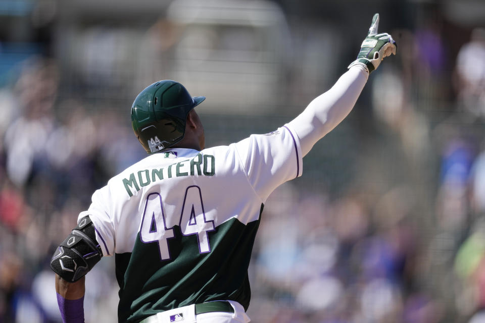 Colorado Rockies' Elehuris Montero gestures as he circles the bases after hitting a two-run home run off Chicago Cubs starting pitcher Jameson Taillon in the fifth inning of a baseball game Wednesday, Sept. 13, 2023, in Denver. (AP Photo/David Zalubowski)