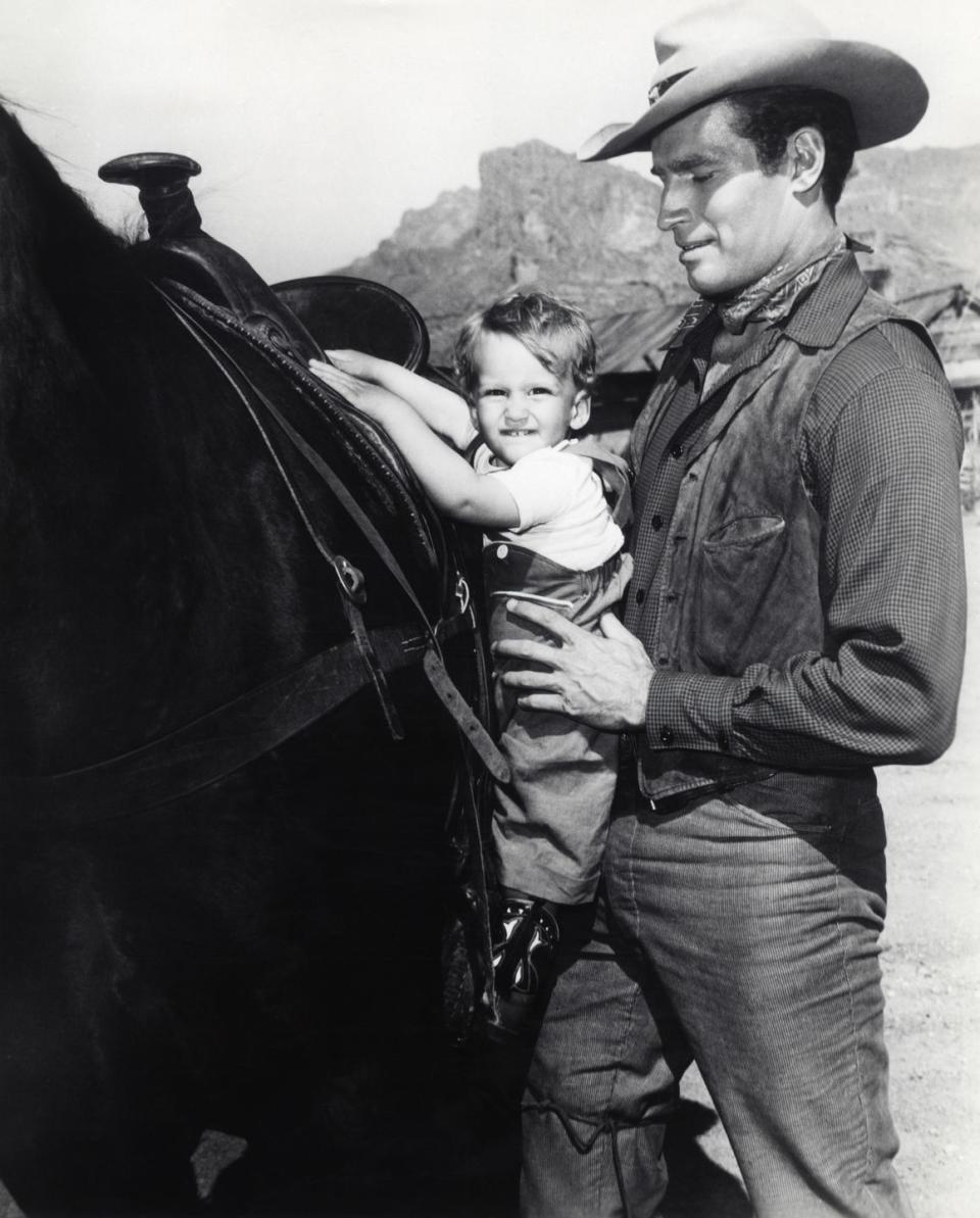 <p>When he was a little over one, Fraser Heston visited his father, Charlton Heston, on the set of one of his Western films, <em>Three Violent People</em>. What he got out of it is not your average pony ride.</p>