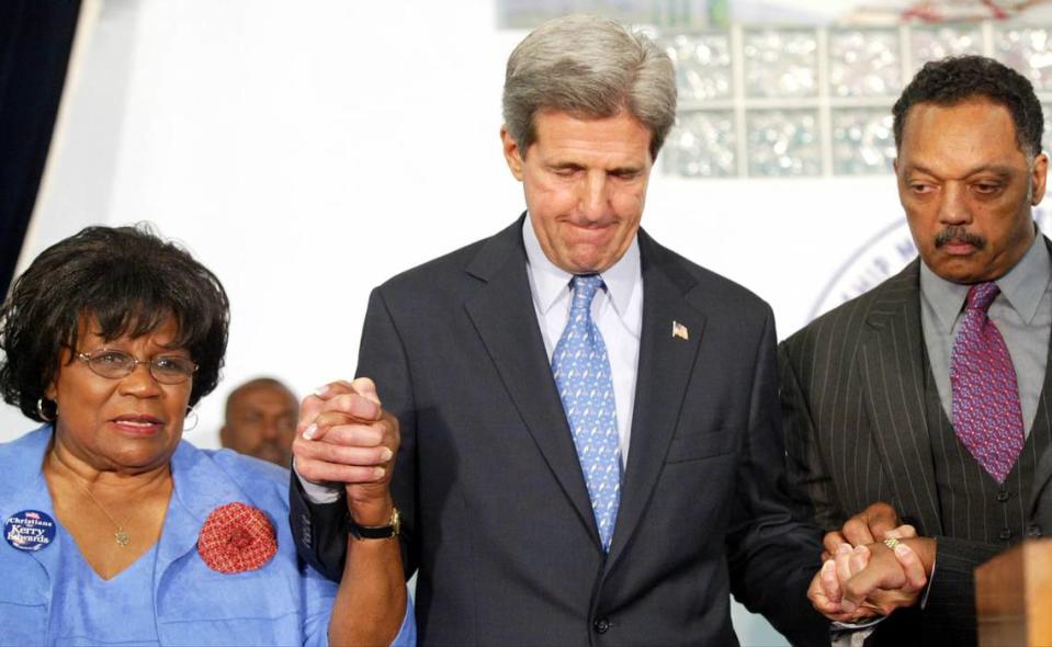 In 2004, former Congresswoman Carrie Meek (left), Sen. Kerry and Rev. Jesse Jackson (right), prayed together. John Kerry attended a service at the 75-year-old Friendship Missionary Baptist Church in Miami, Florida as he made several appearances in the Miami-Dade area.