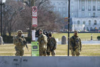 National Guard troops patrol the perimeter of the Capitol in Washington, Thursday, Feb. 25, 2021. (AP Photo/J. Scott Applewhite)