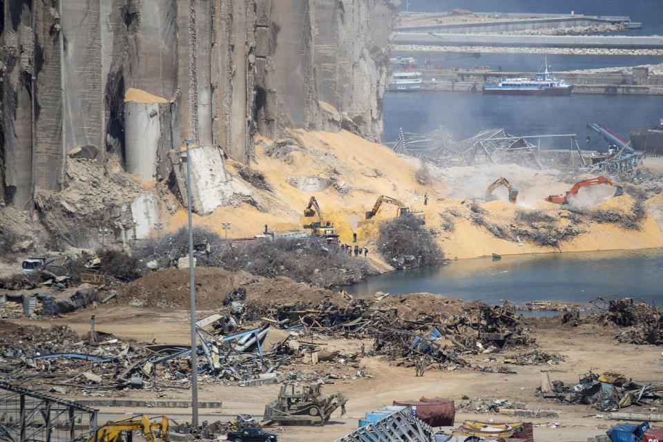 Rescue teams search for missing people at the site of the Aug. 4 explosion that killed more than 170 people, injured thousands and caused widespread destruction, in Beirut, Lebanon, Friday, Aug. 14, 2020. (AP Photo/Hassan Ammar)