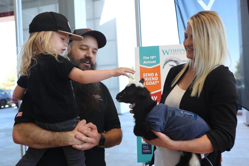 Calvin George and his father, Gerrad, meet a baby goat named Taco. Gerrad’s daughter, Millie, is a Wish Kid for The Wishing Star Foundation.