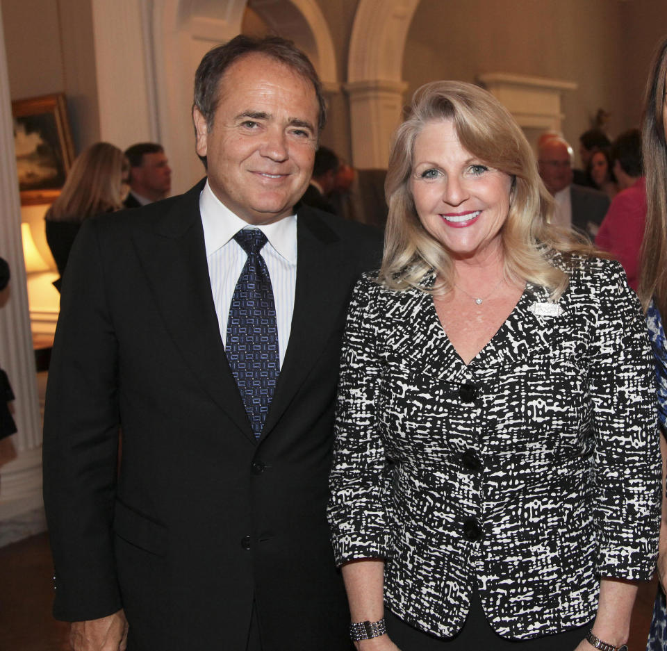 FILE - In this May 5, 2011 file photo provided by the office of the Governor of Virginia, Jonnie Williams left, and Maureen McDonnell, wife of then Gov. Bob McDonnell, pose for a photo during a reception for a NASCAR race at the Executive Mansion in Richmond, Va. The former first lady of Virginia and her husband, former Gov. Bob McConnell, have been indicted on several counts of trading on their influence to enrich themselves and family members. (AP Photo/Office of the Governor of Virginia, Michele White, File)