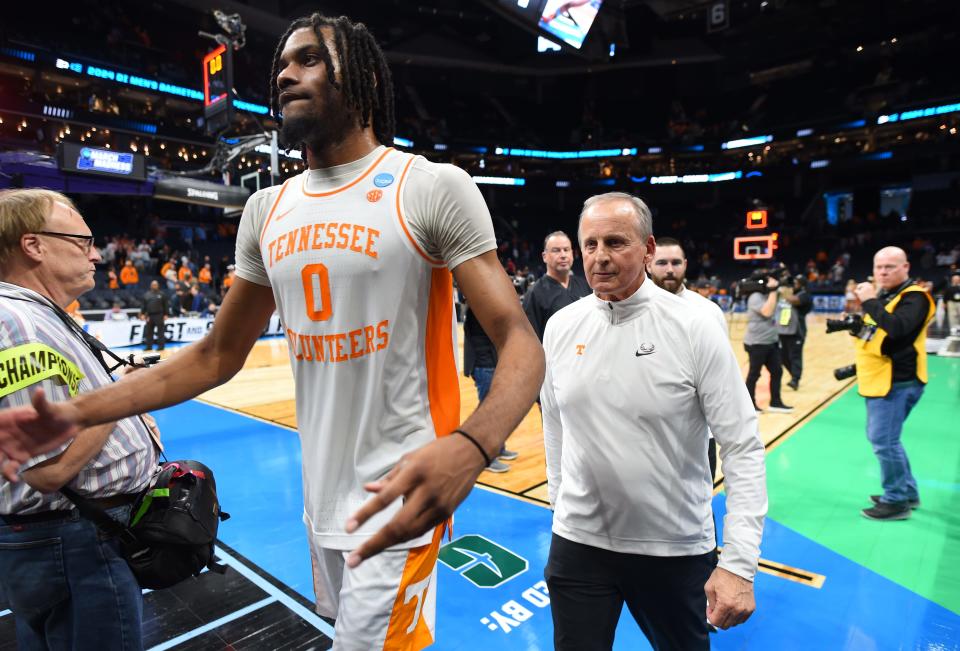 March 23, 2024, Charlotte, NC, USA; Tennessee Volunteers forward Jonas Aidoo (0) and Tennessee Volunteers head coach Rick Barnes walk off the court after defeating the Texas Longhorns in the second round of the 2024 NCAA Tournament at the Spectrum Center. Mandatory Credit: Bob Donnan-USA TODAY Sports