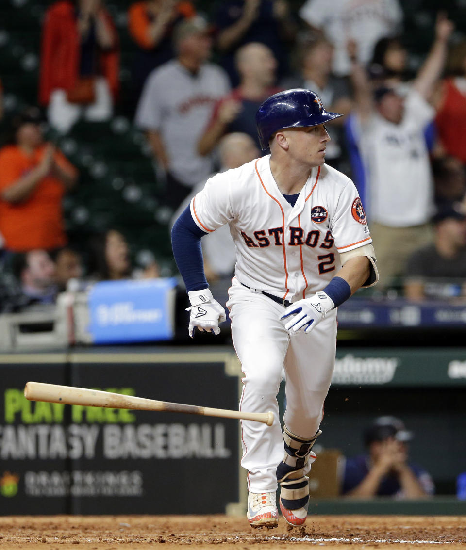 Houston Astros' Alex Bregman flips his bat after hitting a three-run double against the Minnesota Twins during the eighth inning of a baseball game Wednesday Sept. 5, 2018, in Houston. (AP Photo/Michael Wyke)