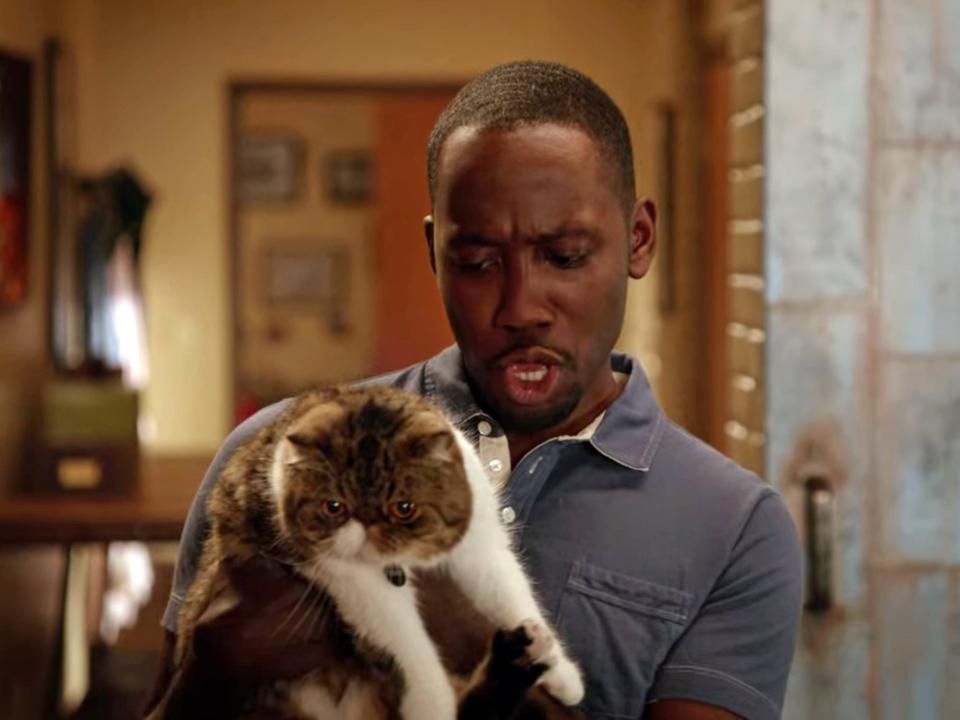 winston holding ferguson on an episode of new girl