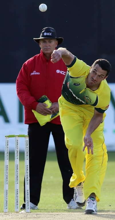 Australia's Nathan Coulter-Nile bowls to Ireland's Paul Stirling during the one day international (ODI) cricket match between Ireland and Australia at Stormont Cricket Club in Belfast on August 27, 2015