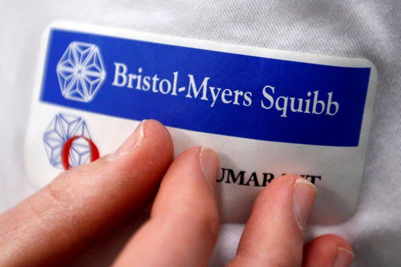 FILE PHOTO: Logo of global biopharmaceutical company Bristol-Myers Squibb is pictured on the blouse of an employee in Le Passage