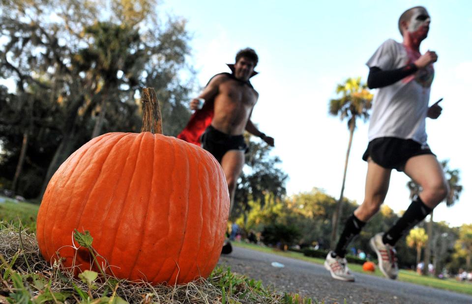 Many runners show up in costume for the Evergreen Pumpkin Run.