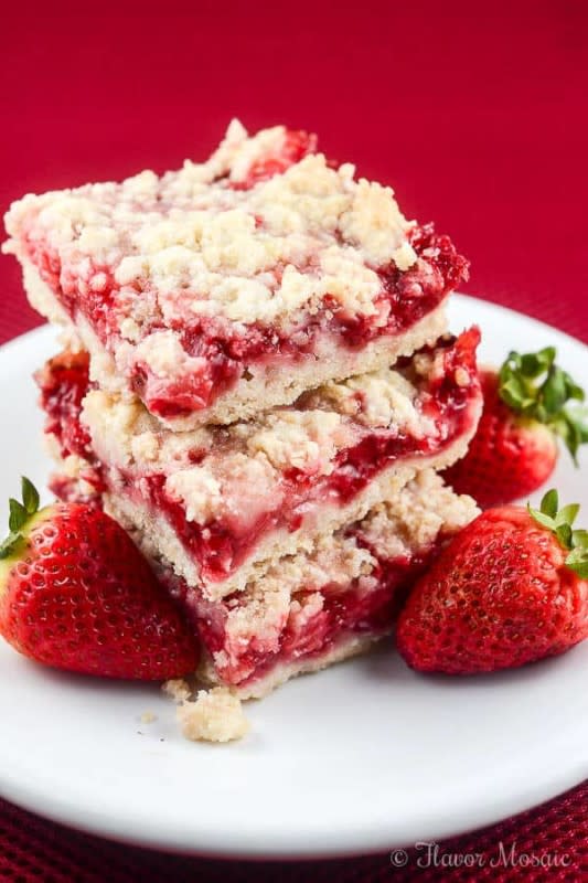 <p>These easy Strawberry Crumb Bars, with a buttery crust, sweet fresh strawberry filling and crunchy butter crumb topping make wonderful dessert bars for an afternoon snack. </p><p>Get the recipe: <a href="https://flavormosaic.com/strawberry-crumb-bars/" rel="nofollow noopener" target="_blank" data-ylk="slk:Strawberry Crumb Bars;elm:context_link;itc:0;sec:content-canvas" class="link rapid-noclick-resp"><strong>Strawberry Crumb Bars</strong></a></p>