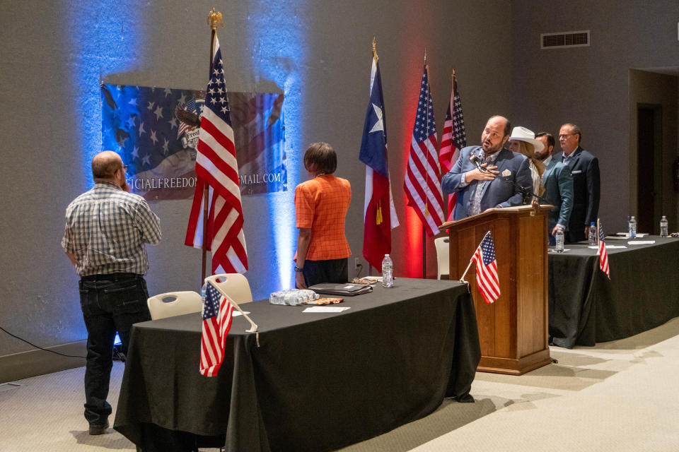 Randall County Commissioner and opera singer Eric Barry leads the mayoral candidates in the "Star Spangled Banner" at a recent candidate debate at the Amarillo Botanical Gardens.