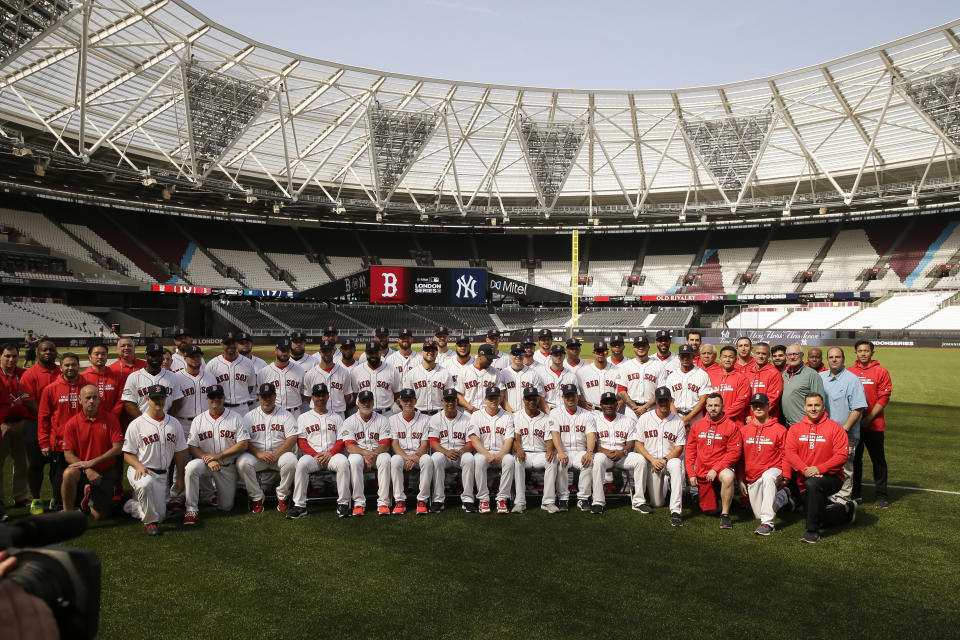 The Boston Red Sox pose for a team pictures in London, Friday, June 28, 2019. Major League Baseball will make its European debut with the New York Yankees versus Boston Red Sox game at London Stadium this weekend. (AP Photo/Tim Ireland)