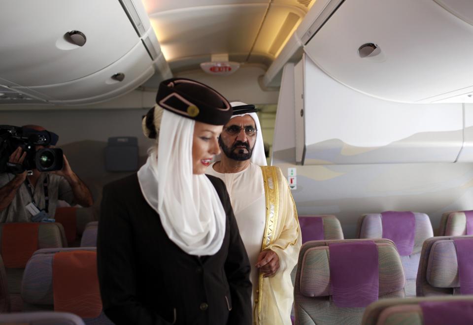 United Arab Emirates' Prime Minister and Ruler of Dubai Sheikh Mohammed is taken on a tour inside an Airbus 319 aircraft during the Dubai Airshow