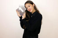 <p>Olivia Rodrigo smiled with her No. 1 award from the Official Charts Company for her hit "Drivers License."</p>