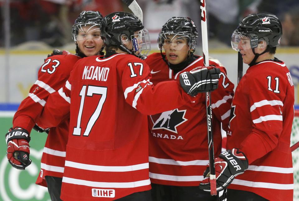 Canada's Reinhart celebrates his goal against the Czech Republic with teammates McDavid, Horvat and Dumba during the first period of their IIHF World Junior Championship ice hockey game in Malmo