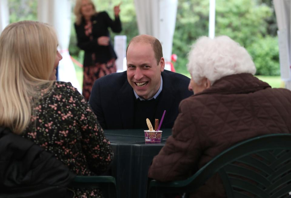 Prince William, Duke of Cambridge chats to resident Betty Magee (96) and her granddaughter Kimberley Anderson during a visit to the Queens Bay Lodge Care Home, that is run by the Church of Scotland through Cross Reach, to meet with staff, residents and families to hear about the impact of COVID-19 on the home on May 23, 2021 in Edinburgh, Scotland.