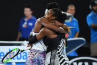 <p>Serena and Venus embrace after the match </p>