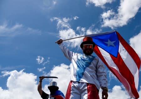 Demonstrator in a costume attends the national strike calling for the resignation of Governor Ricardo Rossello in San Juan